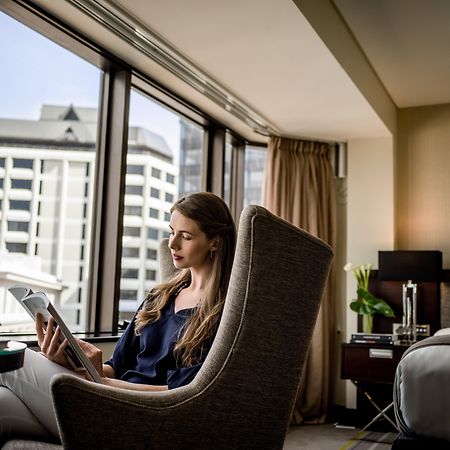 Intercontinental Wellington By Ihg Hotel Exterior photo A guest using a tablet in a room at the hotel