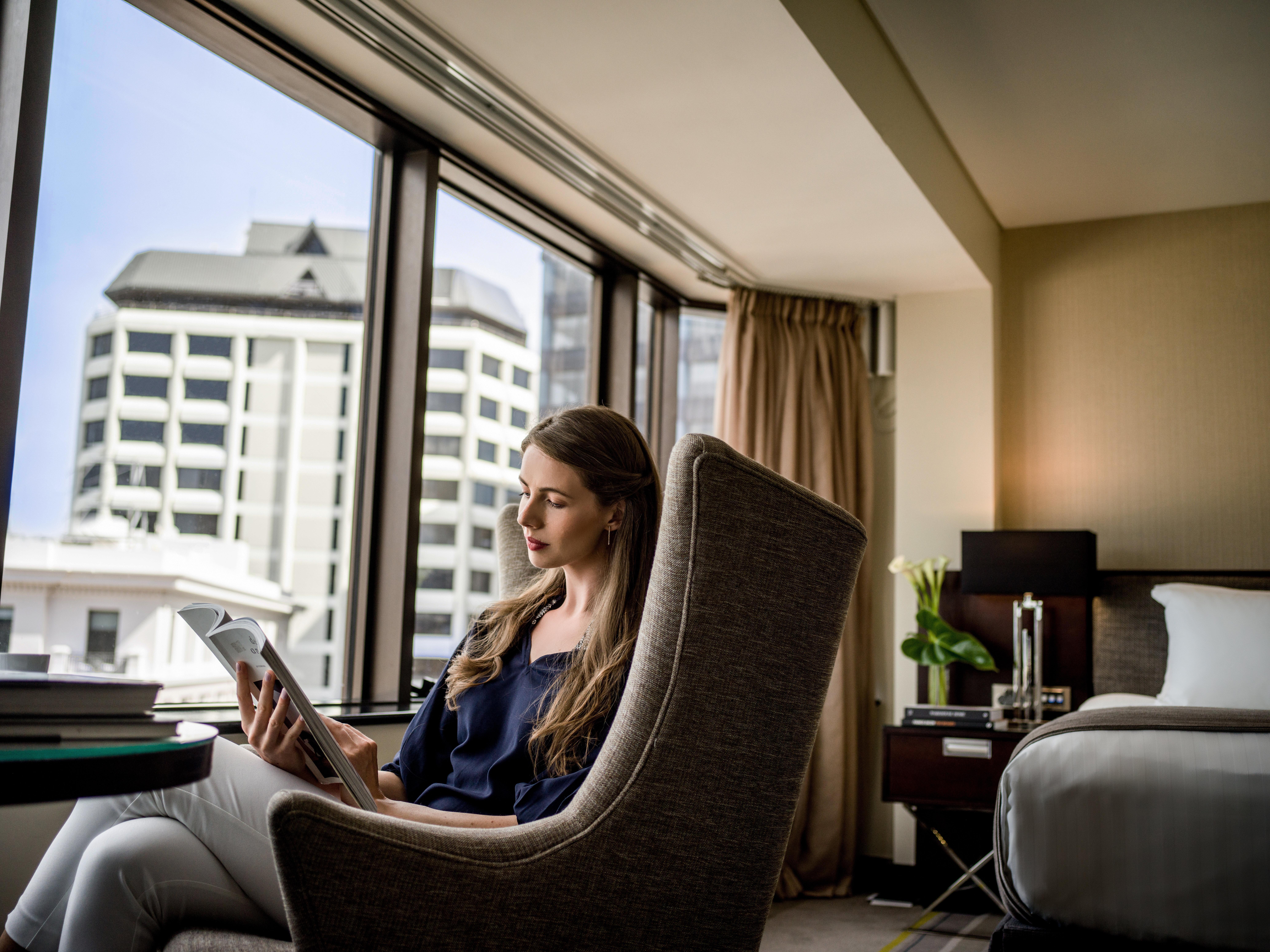 Intercontinental Wellington By Ihg Hotel Exterior photo A guest using a tablet in a room at the hotel